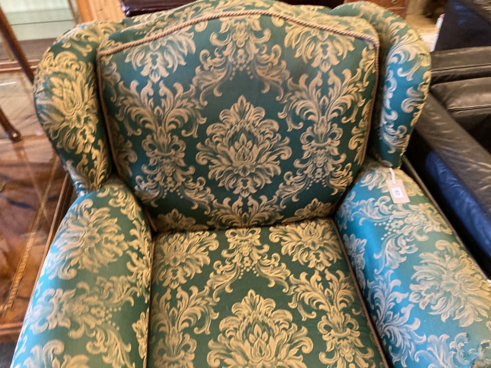 A green and cream brocade upholstered lounge armchair, width 98cm, depth 100cm, height 96cm